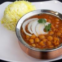 Channa Masala · Gently cooked chickpeas sauteed in a curry with blend of herbsand spices.