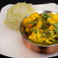 Seasonal Vegetable Curry · South Indian style, fennel, coconut, curry leaves, and poppy seeds.