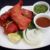 Tandoori Chicken · Bone-in thigh meat, chicken pieces marinated and cooked in a tandoor oven.