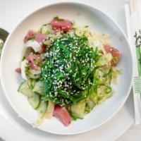 Tuna Poke · Cucumber, fennel, green onion, soy sesame sauce, and seaweed salad.