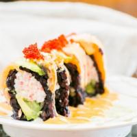 Mill Creek Roll · Black Rice with California roll top with eel and salmon, sweet wasabi sauce, eel sauce and t...