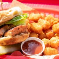 Salmon Burger  · wild salmon burger, seatown tartar sauce, pickled green tomato, fries