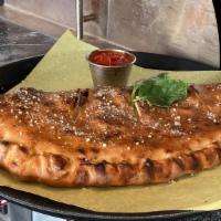 Calzones Large · Mozzarella Cheese, Ricotta, & your choice of 2 toppings