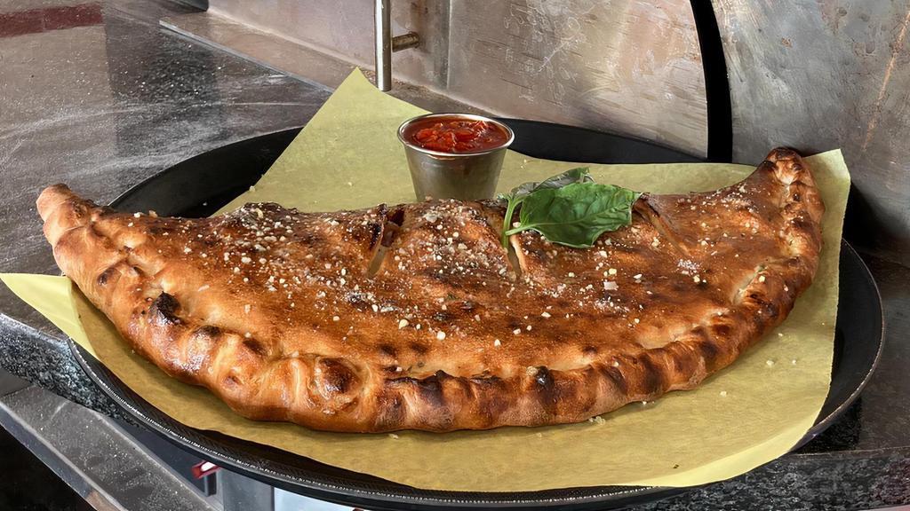 Calzones Small · Mozzarella Cheese, Ricotta, & your choice of 2 toppings