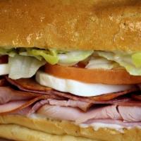 Italian (Hot Or Cold) · Ham, salami, pepperoni, lettuce, tomatoes, mayo, banana peppers, Italian dressing, covered w...