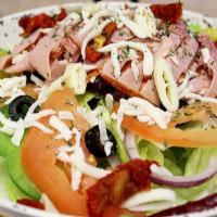 Antipasto Salad · Provolone cheese, sun-dried tomatoes, and sliced variety of meats. All served on a bed of le...