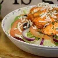 Buffalo Chicken Salad · Breaded chicken breasts, tossed in our in-house made special buffalo sauce. Served on top of...