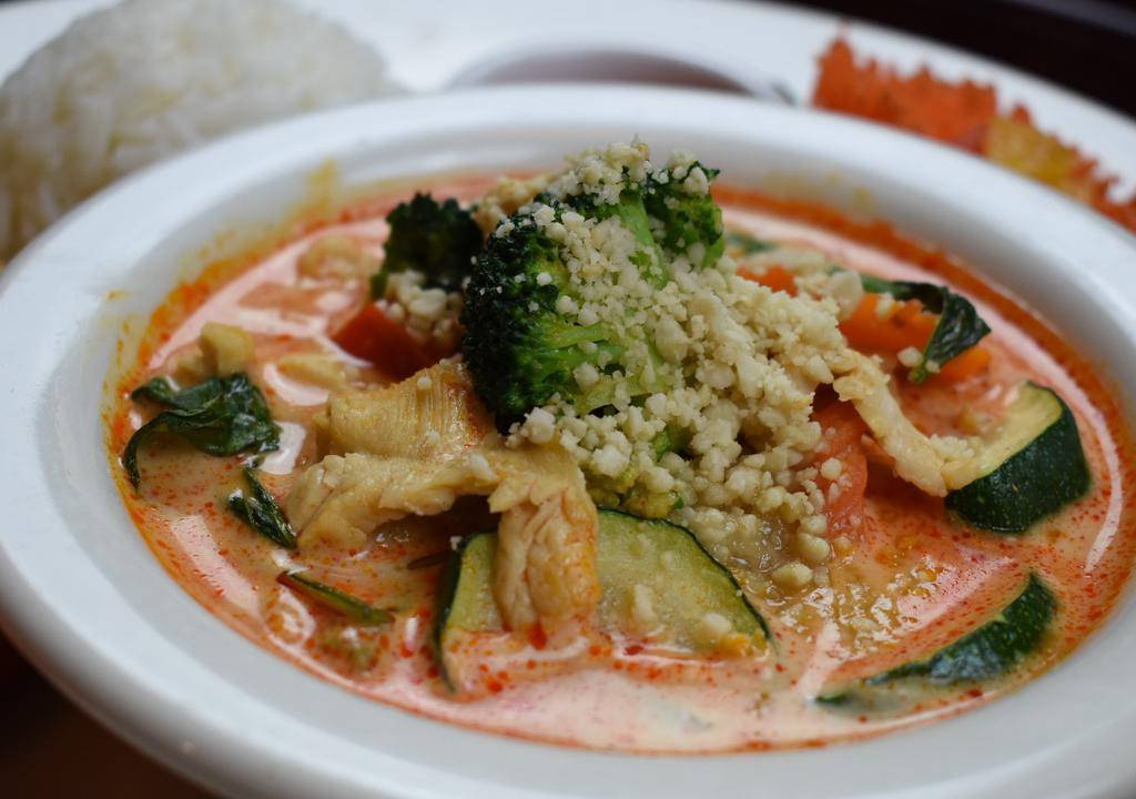 Panang Curry · Spicy. Rich panang curry with coconut milk and crushed peanuts. Served with rice.