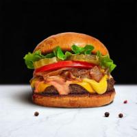 The Classic Burger · American beef patty topped with buttered lettuce, tomato, onion, and pickles. Served on a gr...