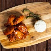 The Wing · Chicken wings fried until perfectly golden served with celery & carrots, your choice of sauc...