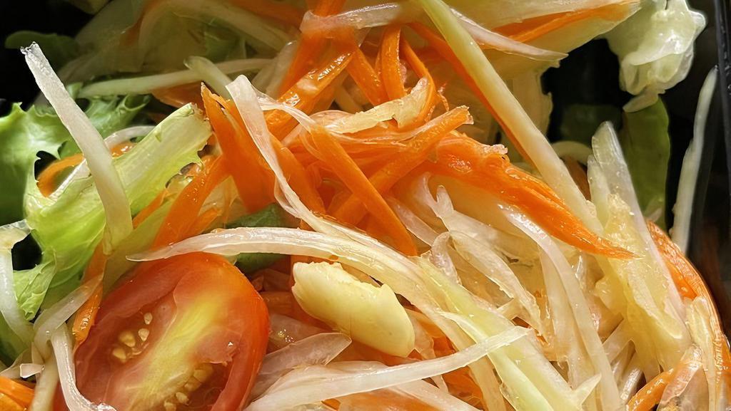 Som Tum (Green Papaya Salad) · Shredded green papaya, tomatoes, green bean, ground peanut with spicy lemon dressing (Add shrimp for $3 extra)
