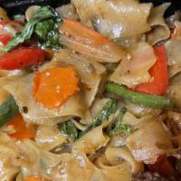 Pad Kee Mao (Drunken Noodle) · Stir fried flat rice noodles with green bean, bell pepper, thai herbs, chilies and basil wit...
