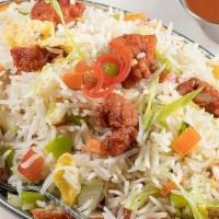 Wok Fried Rice · Long grain basmati rice tossed with fresh vegetables, sauces and condiments.