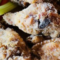 Crispy Chicken Wings · Dry rub Cajun, buffalo, lemon pepper.