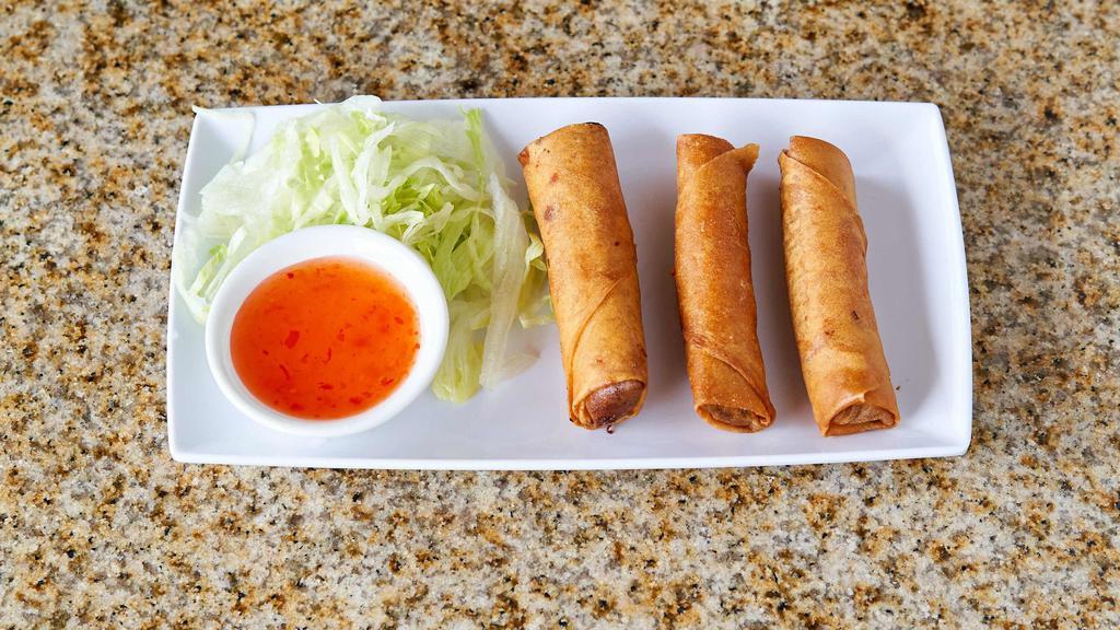 Chả Giò - Crispy Rolls · Crispy rolls filled with ground pork, shrimps, glass noodles, finely chopped taro, carrots, and a side of sweet chili sauce.