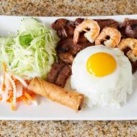 Com Đặc Biệt - Special Rice Combo · Grilled honey lemongrass pork or chicken, shrimp, egg rolls, egg, and vegetables.