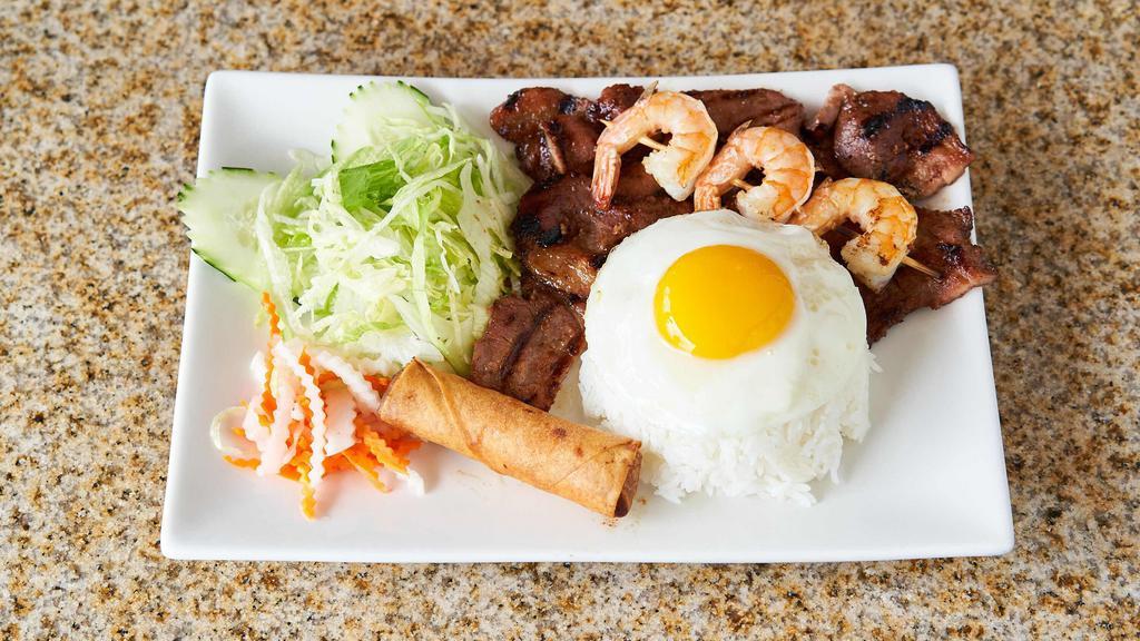 Com Đặc Biệt - Special Rice Combo · Grilled honey lemongrass pork or chicken, shrimp, egg rolls, egg, and vegetables.
