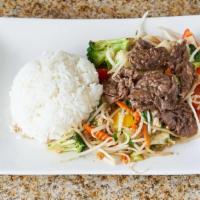 Com Bò Xào - Sauté Beef Rice · Sauté beef with garlic, bean sprouts, bell pepper, bok choy, cabbage and broccoli.