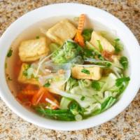 Tofu Noodles Soup - Vegetarian Noodle Soup · Vegetarian broth with rice noodles, fried tofu, chopped bell pepper, cabbage, bok choy, broc...
