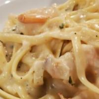 Shrimp Alfredo · Fettuccine Noodles Tossed With Sautéed Shrimp In A White Wine Cream Sauce