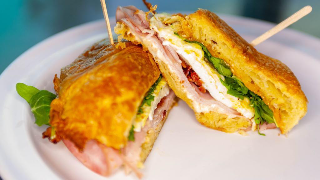 Spark Croissant (Regular) · Toasted croissant, salsa mayo, ham, bacon, fresh mozzarella, Cheddar, egg & arugula.