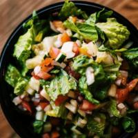 House Salad - Side · Green leaf lettuce, diced tomatoes, cucumbers, and onions. Served with a side of  Balsamic D...