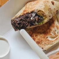 Bean Burrito Wrap · Black beans, onions, cashew-coconut cheese and Himalayan pink salt served in a brown rice wr...