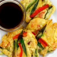 Hae-Mul-Pa-Jon (Korean Seafood Pancake) · A harmony of squid, shrimp, green onions, bell peppers, and onions in a flavorful batter. A ...