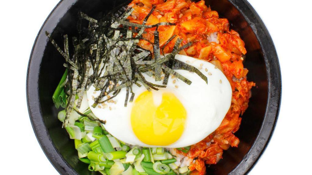 Kimchi Dolsot · Fried kimchi and rice served in a hot stone bowl cooked to a golden crispy crust. Served with side dishes.
*Sunny side up eggs are undercooked. Consumption of undercooked eggs may increase the risk of food-borne illness.