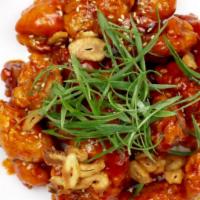 Korean Fried Chicken · Sweet and spicy boneless fried chicken packed with infused flavors topped with fried garlic ...