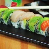 Rainbow Roll · Kani, cucumber, topped with tuna, salmon, cucumber, yellow tail, & avocado.