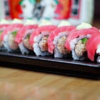 Sakura Roll · Snow Crab & avocado wrapped in tuna & topped with Chef Sauce.

*Consuming raw or undercooked...