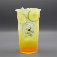 Golden Beach · Sparkling water, lime slices, mango syrup.