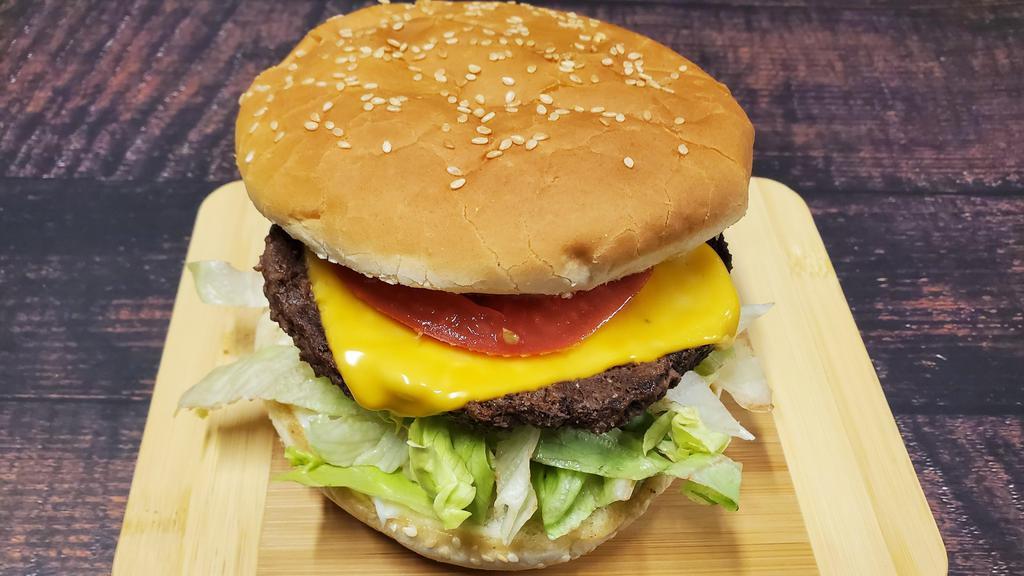 Cheesy Burger · A classic style cheeseburger made with our house seasoned beef patties with melted American cheese topped with fresh lettuce, tomatoes, and onions. Mayo included.
