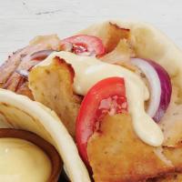 Chicken Gyro · Chicken with spices, served on Pita Bread with lettuce, tomatoes, onions, and tzatziki sauce.