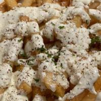 Greek Fries · French fries topped with feta cheese and garlic sauce