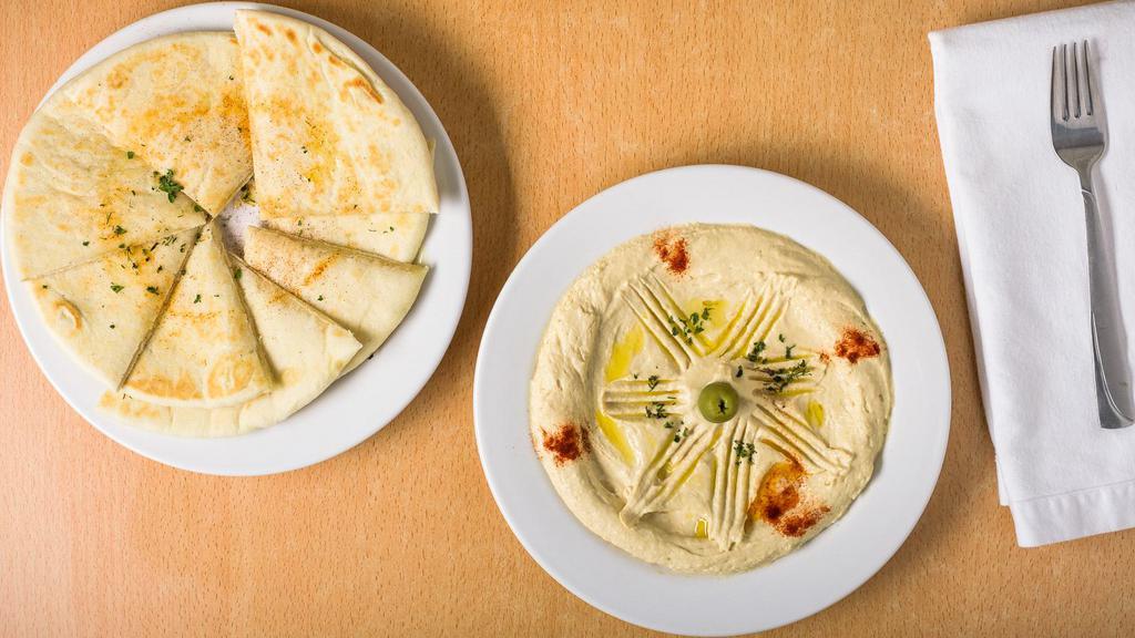 Hummus & 2 Pita · Creamy Hummus with Olive Oil, Variety of Olives and Smoked Paprika. Comes with 2 Pita's