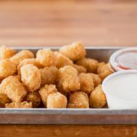 Tater Tots · Sea salt seasoned tater tots. Served with a side of ranch or ketchup.