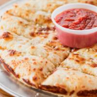 Cheesy Breadsticks · Breadsticks topped with olive oil, mozzarella or provolone cheese, Parmesan and herbs.
