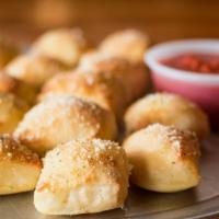 Breadstick Bites · Dough bites topped with butter, Parmesan and herbs. Served with marinara.