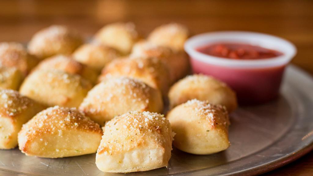 Breadstick Bites · Dough bites topped with butter, Parmesan and herbs. Served with marinara.