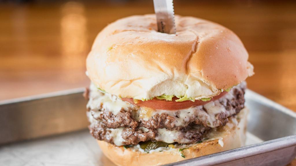 Fallen Burger · Spicy. Fan-favorite. Ground chuck Angus beef, grilled onions, jalapeños, avocado, cilantro mayo, tomatoes and Pepper Jack cheese.