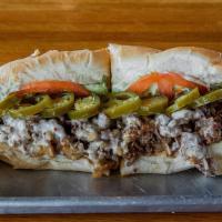 Psycho Cheesesteak · Spicy. Fan-favorite. Sirloin, grilled onions, jalapeños, avocado, cilantro mayo, tomatoes an...