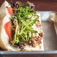 Boston Strangler V2 Cheesesteak · New. Sirloin, horseradish sauce, grilled onions, mixed greens, tomatoes and blue cheese.