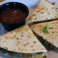 Quesadilla · Our Giant Flour Tortilla, filled with melted cheddar and jack cheese, served with sour cream...