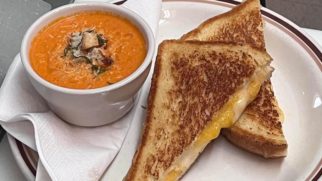 The Classic Grilled Cheese · Cheddar Cheese grilled on Sourdough Bread.