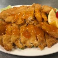 Lemon Chicken Dinner · Deep-fried chicken breast cut in small pieces sauteed with lemon sauce.