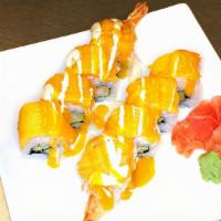 Hawaiian Roll · Tempura shrimp topped with snow crab and fresh mango and special sauce. Raw.