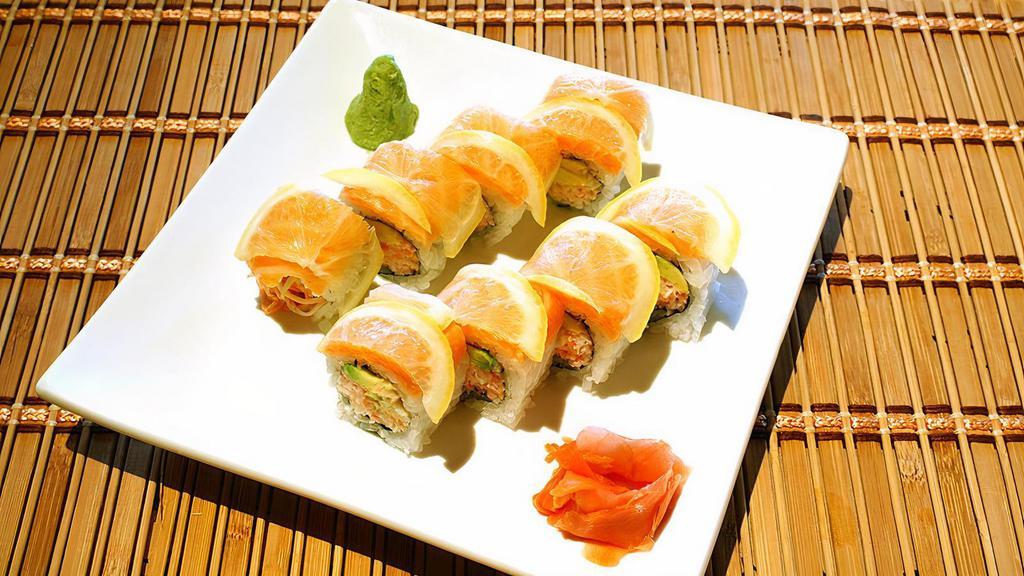 Ichi Sushi Roll · California roll topped with fresh salmon and sliced lemon served with ponzu sauce. Raw.