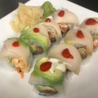 Venetian Roll · Spicy salmon and avocado roll topped with avocado, white tuna, and spicy sauce.